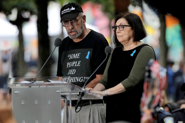 Image: Nick Haros, left, reads victim names during ceremonies commemorating the 18th anniversary of the Sept. 11 terrorist attacks in Lower Manhattan on Sept. 11, 2019. H