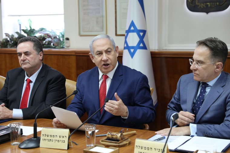 Image: Israeli Prime Minister Benjamin Netanyahu, Foreign Minister Israel Katz, left,  and Government Secretary Tzachi Braverman attend the weekly cabinet meeting in Jerusalem