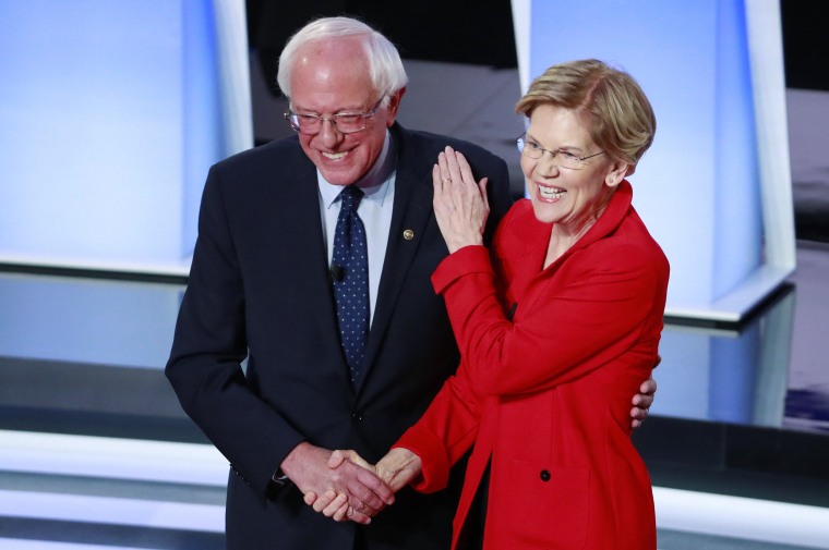 Image: U.S. Senators Sanders and Warren shake hands before the start of the first night of the second 2020 Democratic U.S. presidential debate in Detroit, Michigan, U.S.