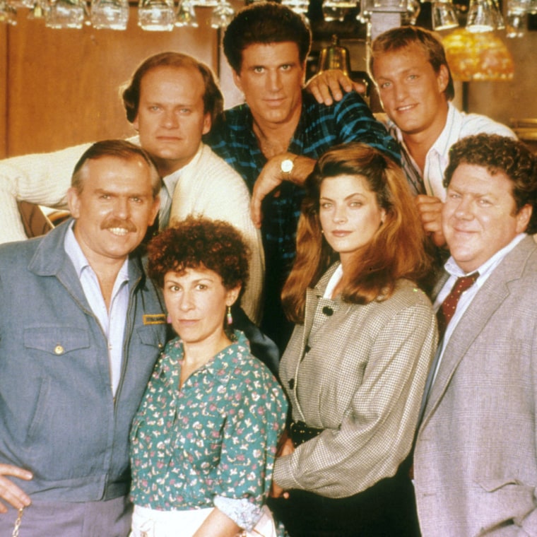 CHEERS KELSEY GRAMMER as Dr Frasier Crane, TED DANSON as Sam Malone, WOODY HARRELSON as Woody Boyd [front row] JOHN RATZENBERGER as Cliff Clavin, RHEA PERLMAN as Carla Tortelli, KIRSTIE ALLEY as Rebecca Howe, GEORGE WENDT as Norm Peterson [Front] ,