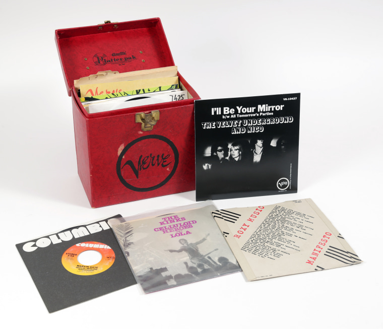 The collection of records includes vinyls by bands including the Velvet Underground. 
