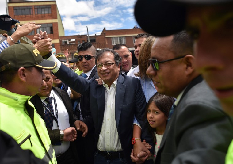 Image: Presidential candidate Gustavo Petro waves to supporters