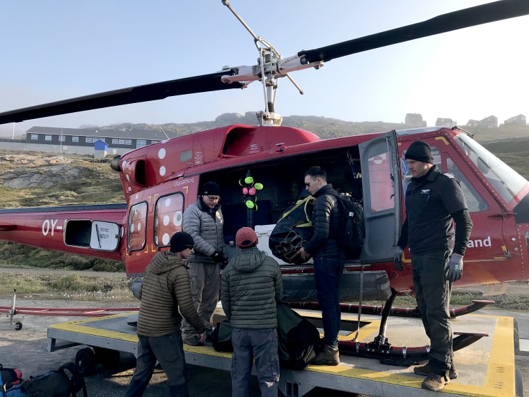 A scientist, a logistics coordinator, a mountaineering guide and me, an NBC News reporter were stuck on Helheim Glacier in Greenland overnight without being fully prepared.