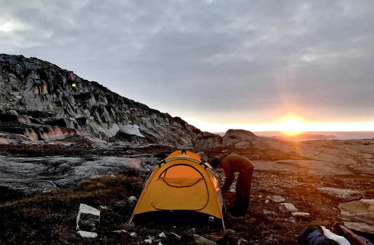 A scientist, a logistics coordinator, a mountaineering guide and me, an NBC News reporter were stuck on Helheim Glacier in Greenland overnight without being fully prepared.