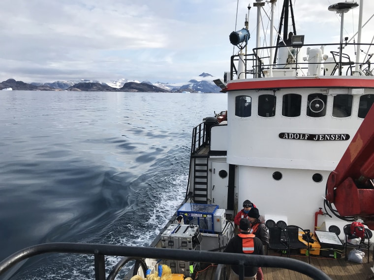 A scientist, a logistics coordinator, a mountaineering guide and me, an NBC News reporter were stuck on Helheim Glacier in Greenland overnight without being fully prepared.