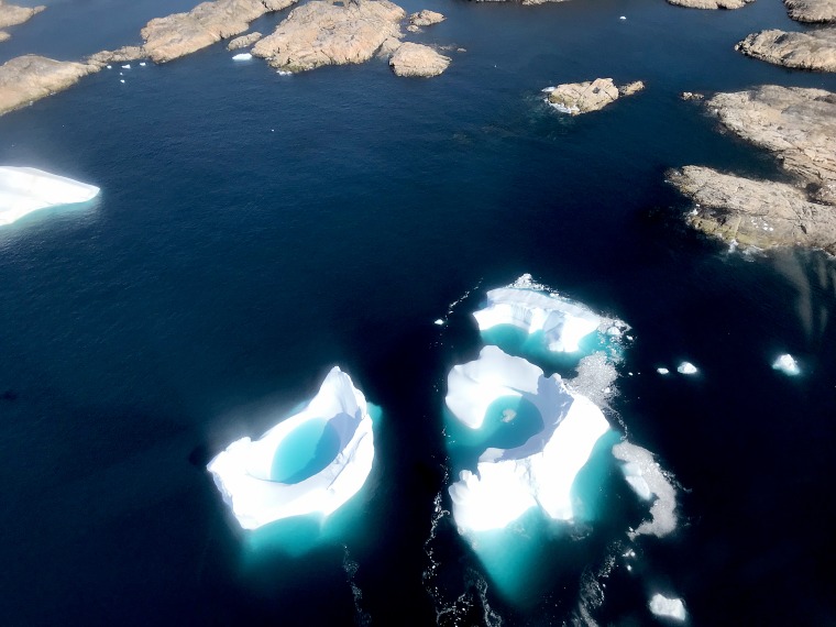 A scientist, a logistics coordinator, a mountaineering guide and me, an NBC News reporter were stuck on Helheim Glacier in Greenland overnight without being fully prepared.