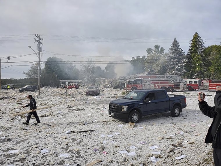 A man works at the scene of a deadly propane explosion on Sept. 16, 2019, which leveled new construction in Farmington, Maine.