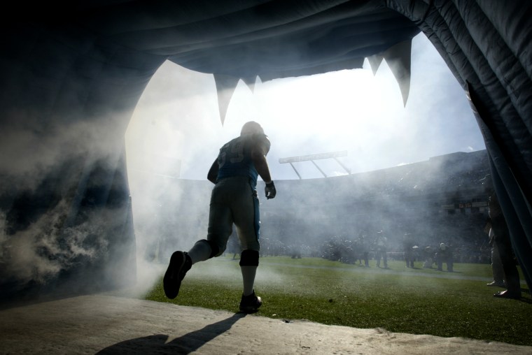 Image: A Carolina Panthers player takes the field in Charlotte, N.C., in 2004.