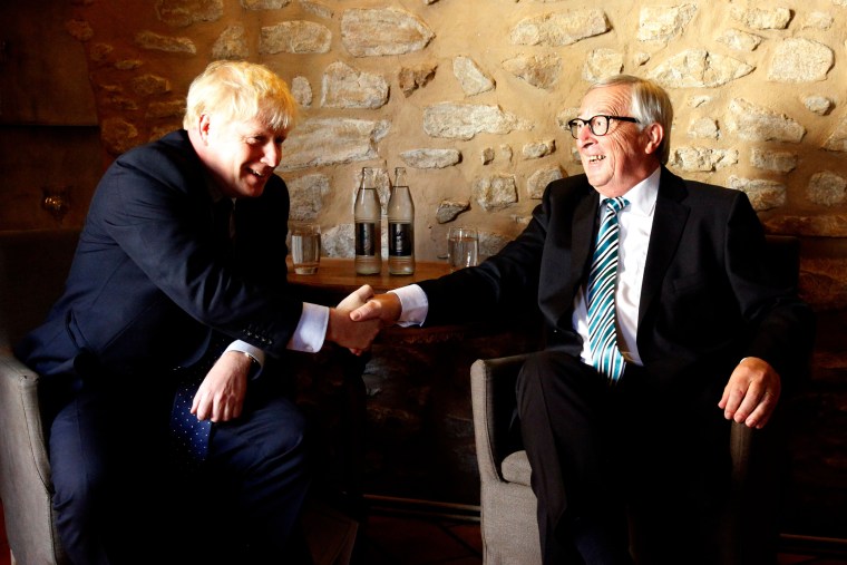 Image: EU Commission president Jean-Claude Juncker shakes hands with British Prime Minister Boris Johnson prior to their meeting,