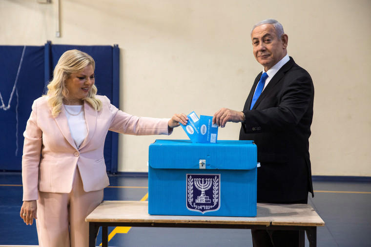 Image: Israeli Prime Minister Benjamin and his wife Sara casts their votes during Israel's parliamentary election at a polling station in Jerusalem