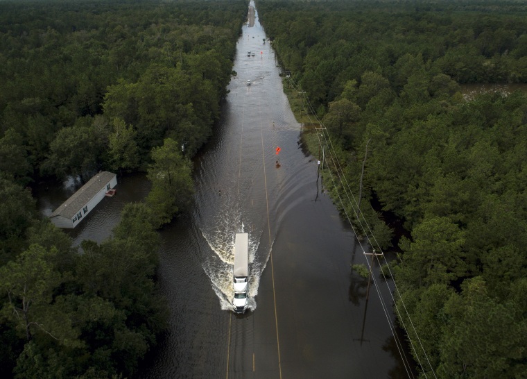 Image: Flooded highway, truck, Texas flood
