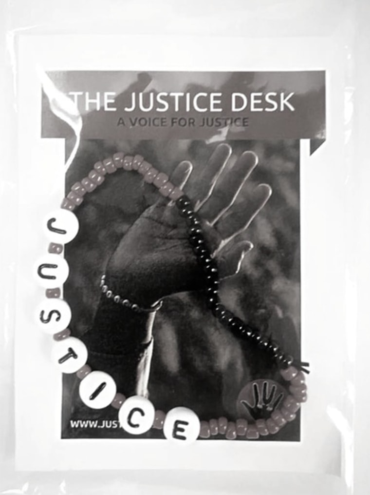 Sales of the bracelets benefit the Justice Desk initiative.