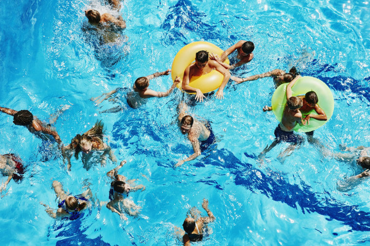 Image: Group of kids playing together in outdoor pool