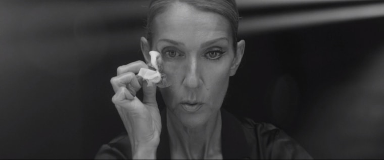 Throughout the video, Dion is seen wiping her face to remove her makeup.