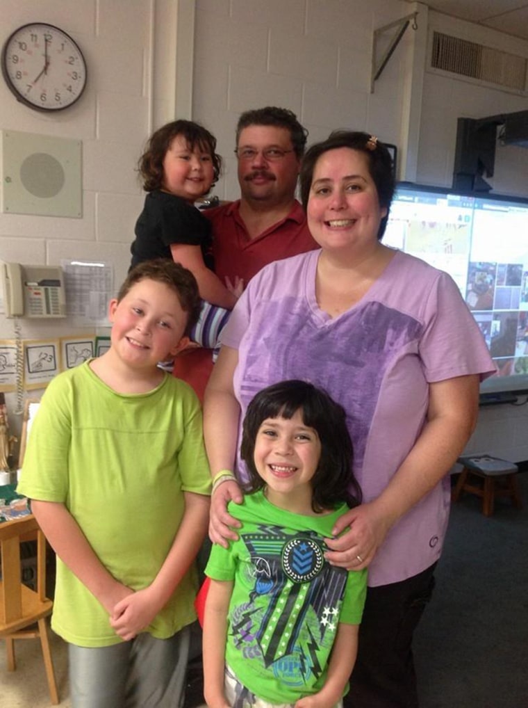 Jennifer Neville-Lake with her husband, Edward Lake, and their children Daniel, Harry and Milly.