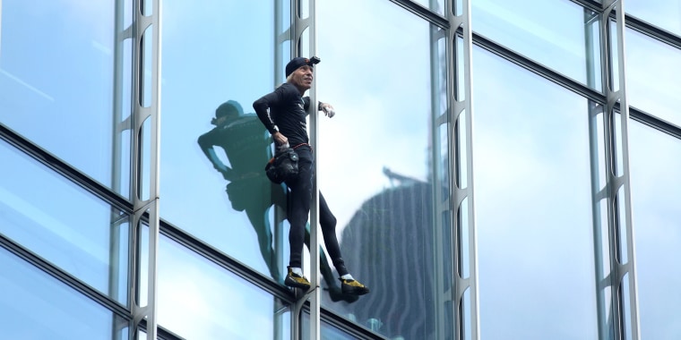 French urban climber Alain Robert climbs the Skyper building in Frankfurt