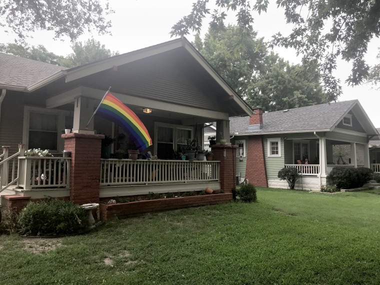 The pride flag hanging outside the home before the arson incident.