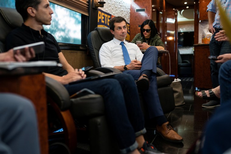 Image: Pete Buttigieg, South Bend Mayor and Democratic presidential hopeful, takes a question from the press on his campaign bus during a four day tour of Iowa