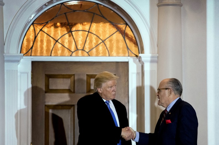 Image: President-elect Donald Trump and Rudy Giuliani shake hands following a meeting at Trump International Golf Club in Bedminster, N.J., on Nov. 20, 2016.