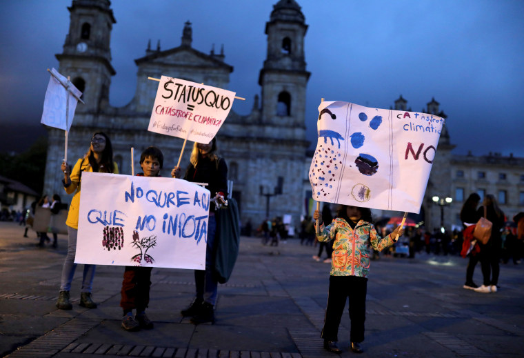 Image: People hold signs at the Global Climate Strike in Bogota, Colombia, on Sept. 20, 2019.