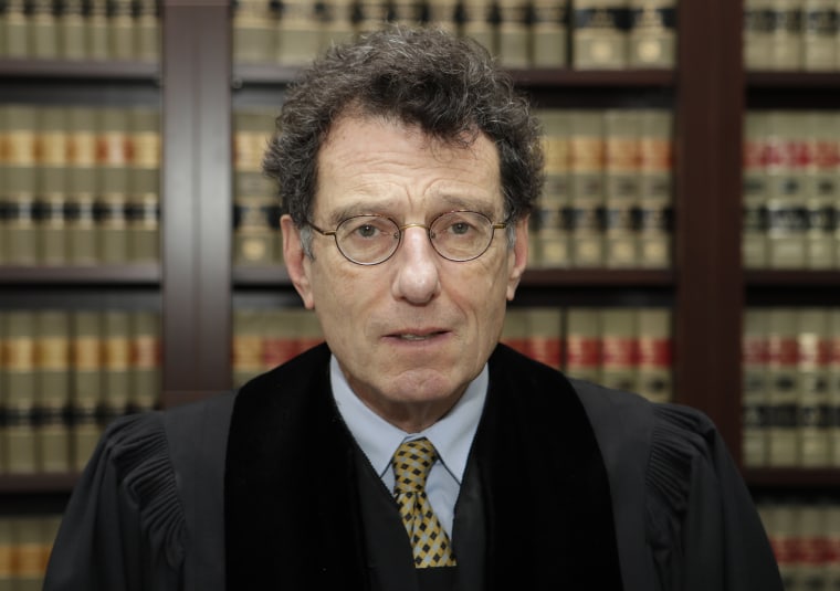 Judge in opioid litigation won't remove himself from case