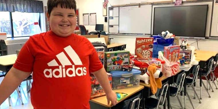 Tennessee third grader Daniel Hunt was beaming after his classmates surprised him with all new toys in the wake of his family's home burning down a week earlier. 
