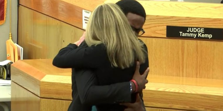 Brandt Jean, whose older brother was killed while sitting in his apartment, hugged former Dallas police officer Amber Guyger after she was sentenced to 10 years in prison for the murder. 