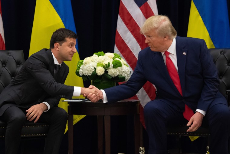 Image: President Donald Trump and Ukrainian President Volodymyr Zelensky shake hands during a meeting in New York