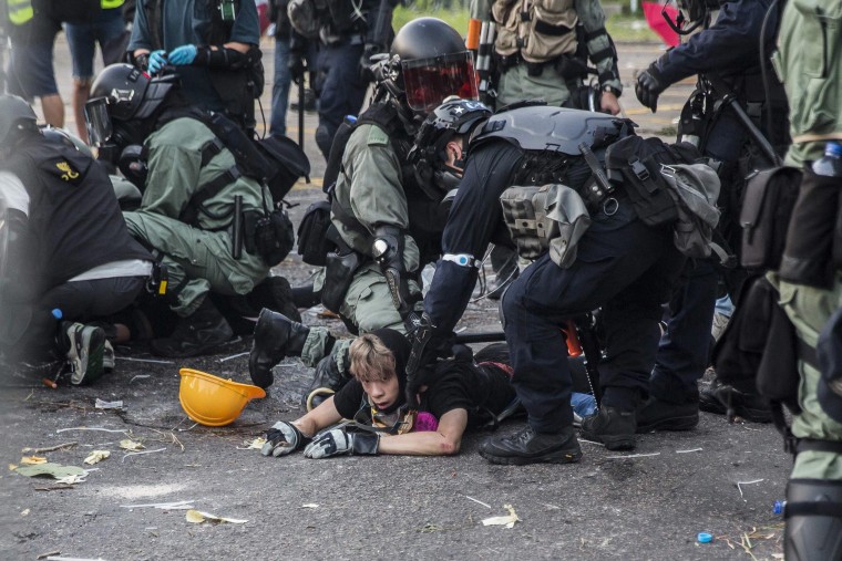 Image: Police detain demonstrators in the Sha Tin district of Hong Kong