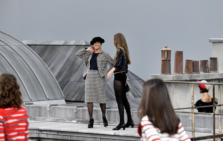 Image: Gigi Hadid approaches the woman who climbed onto the runway during the Chanel Spring/Summer 2020 show in Paris on Oct. 1, 2019.
