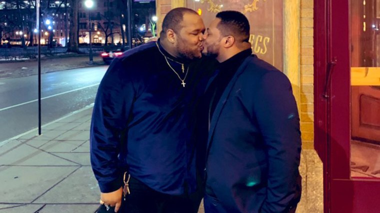 photos of two black gay men making out