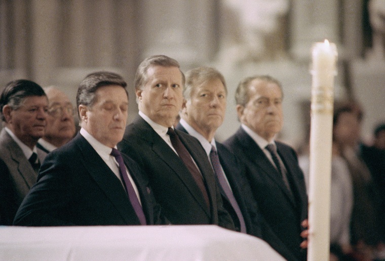 Yankee's owner George Steinbrenner, center, and former President Richard Nixon, end right, attend the funeral of Billy Martin at St. Patrick's Cathedral in New York, Dec. 29, 1989.