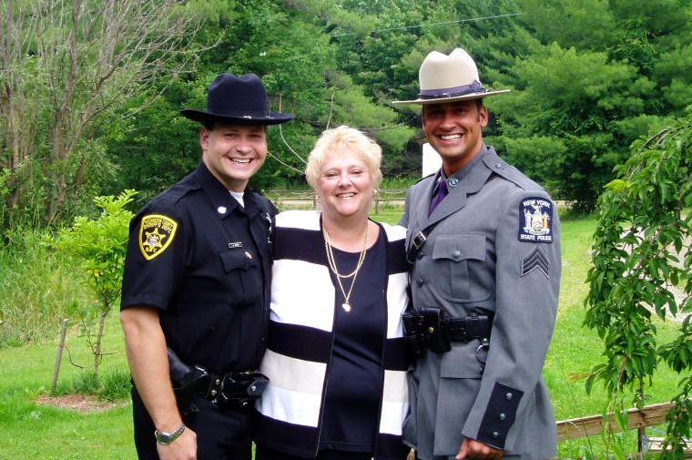 Jim Banish, now 43, left, and his brother Joseph Banish stand with their mother in upstate New York. Joseph, a New York State Trooper, died by suicide in 2008. "I'll never let him be forgotten," Banish said. "He was too good of a person to just be another number."