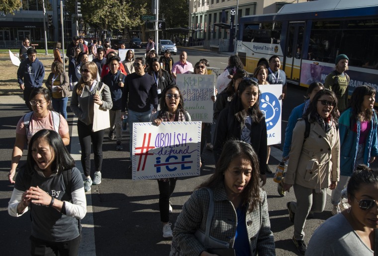 Image: Demonstrators protest the detentions and deportations of Cambodian Americans by ICE in Sacramento, Calif.,