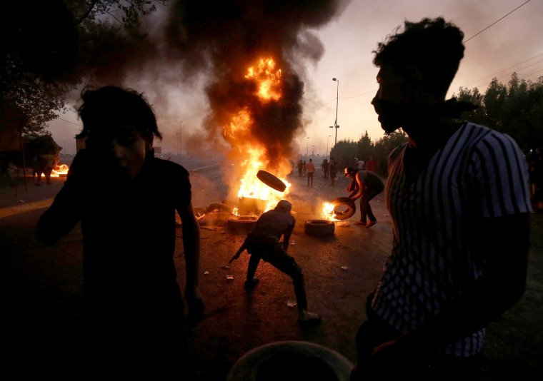 Image: TProtesters burn tires during a demonstration in Baghdad, Iraq, on Oct. 5, 2019.