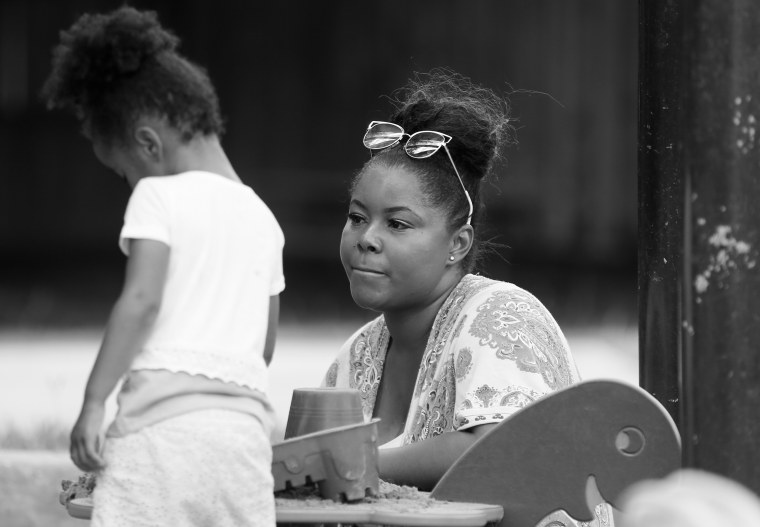 Ajshay James with her daughter.