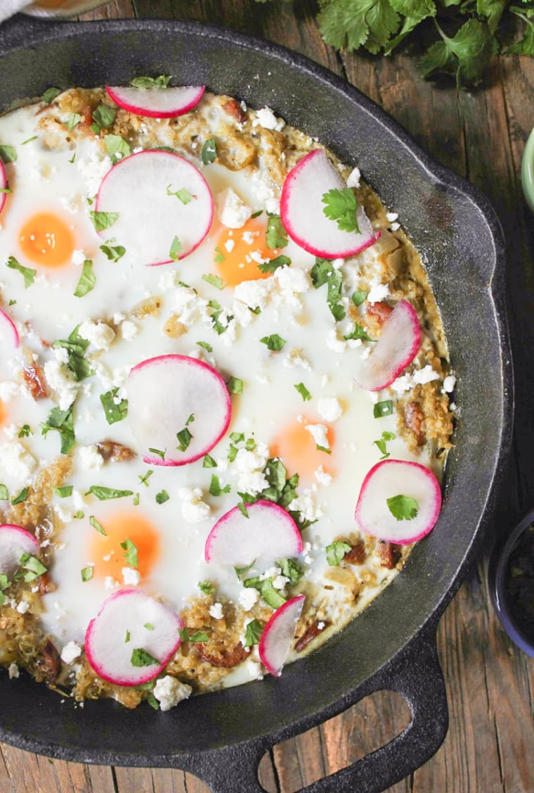 https://media-cldnry.s-nbcnews.com/image/upload/t_fit-760w,f_auto,q_auto:best/newscms/2019_41/3041856/baked-eggs-with-quinoa-chicken-sausage-and-salsa-verde-8.jpg