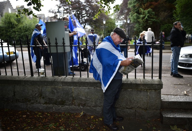 Image: A protester takes a moment before a Scottish Independence rally in Aberdeen this August that attracted some 12,000 people.