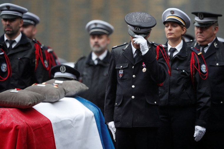 Image: French Police officers attend a ceremony to honour four victims of Paris police attack