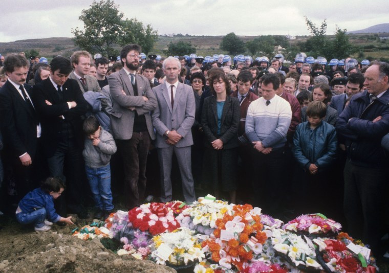 Image: Sinn Fein leader Gerry Adams (fourth from left) and Sinn Fein deputy leader and alleged IRA chief of staff, Martin McGuinness (third from left) attend the funeral of an IRA volunteer in Buncrana, County Donegal, Ireland