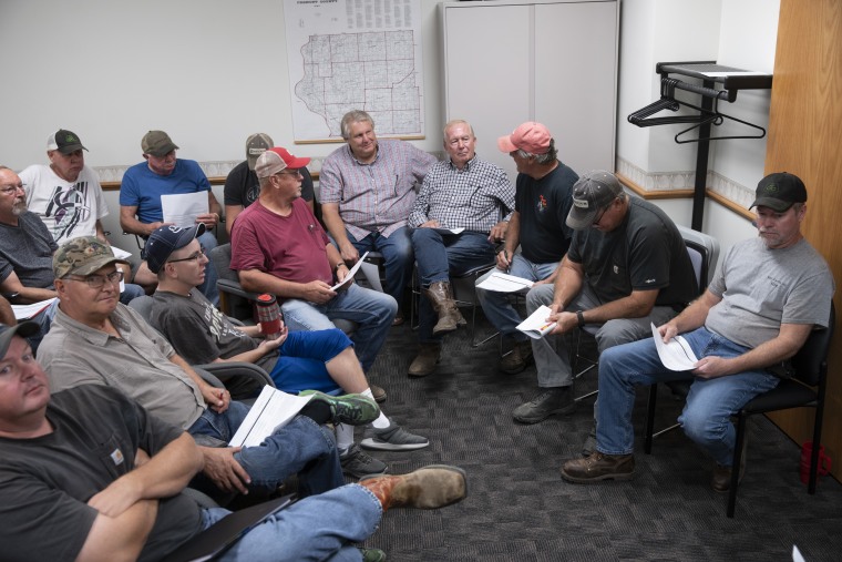 Farmers gather at the USDA office in Sidney, Iowa, to hear learn that they will receive $2.70 for each bushel of grain they lost to the flood that occurred earlier this year. That price, which was under the cost of production, left some wondering if they would be able to continue.