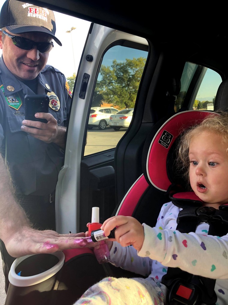 Braelyn Fernelius painted the nails of Battalion Chief Allen Hadley and Captain Kevin Lloyd. 