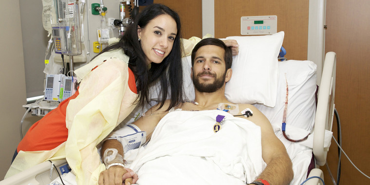 Maura Herrera with her husband, Derek Herrera, during his Purple Heart ceremony at the Walter Reed National Military Medical Center