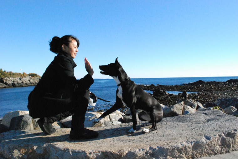 Darlene Horn high fives her dog, Doctor.