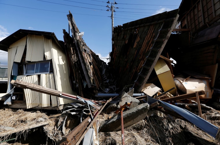 Image: Destroyed houses are seen, in the aftermath of Typhoon Hagibis, in Koriyama