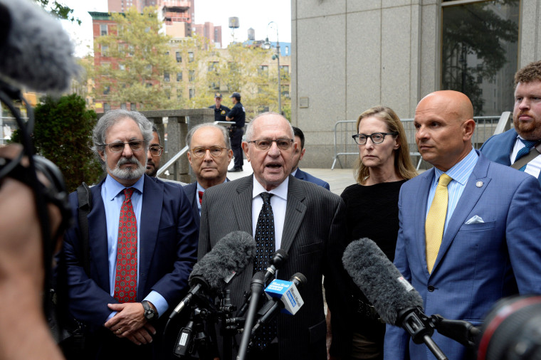 Image: Alan Dershowitz and his legal team, including Howard Cooper, wife Carolyn Cohen and Arthur Aidala leave the Manhattan Federal Court in New York