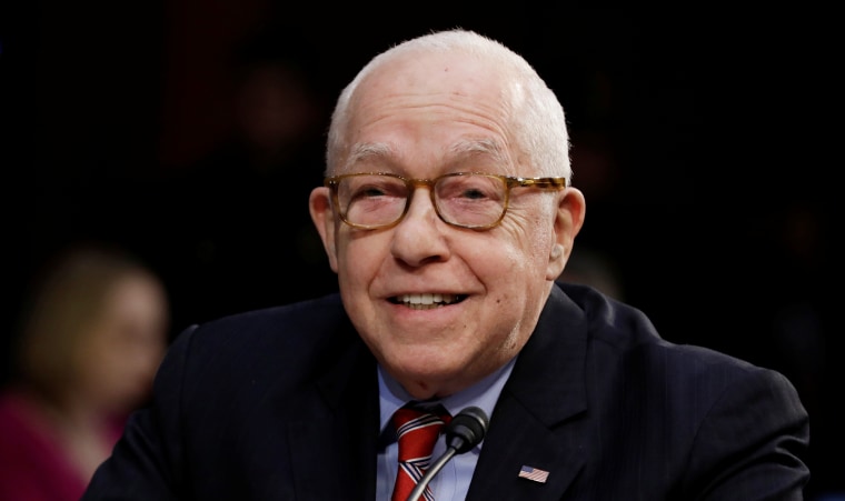 Former U.S. Attorney General Michael Mukasey testifies during a Senate Judiciary Committee nomination hearing for William Barr
