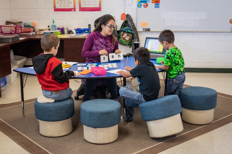 Yajaira Lazos, a teacher's aide at Duckwater, instructs some of the youngest students. 