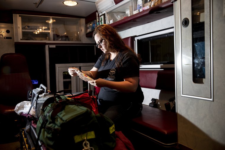 Image: Rebecca Bumgardner prepares for a call at the office in Marmarth, N.D. on Sept. 17, 2019.