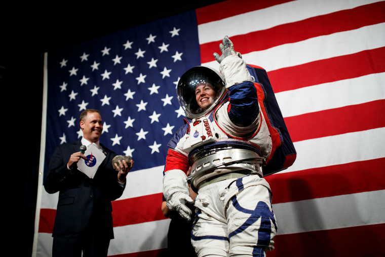 Image: NASA Administrator Jim Bridenstine introduces NASA advance space suit engineer Kristine Davis as she demonstrates the prototype exploration extravehicular mobility unit at NASA Headquarters in Washington on Tuesday, Oct. 15, 2019. (Ting Shen/The Ne